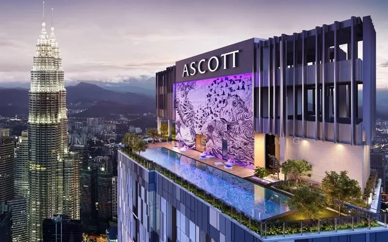 Exterior type: high-rise condominium; features: infinity pool, pool deck with loungers, landscaped garden, outdoor seating area, city skyline view, feature wall with mural, illuminated signage, surrounded by mature greenery; style: modern.