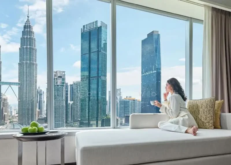 Living features: large floor-to-ceiling windows, city skyline view, white sofa, decorative cushions, coffee table, area rug, curtains, light-colored walls, wooden flooring, decorative plant; style: modern; view: city.
