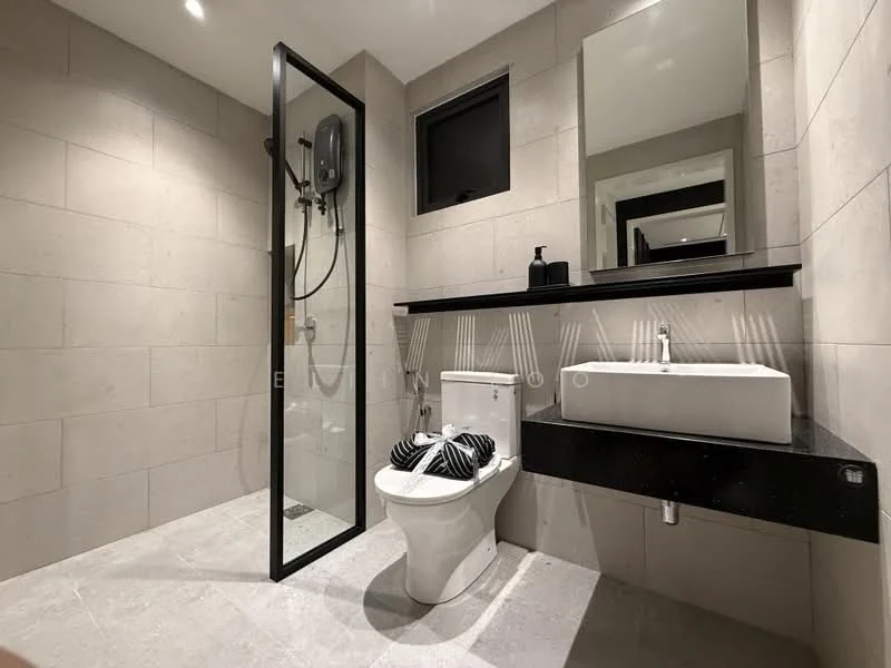 Bathroom features: walk-in shower with glass enclosure, rain shower head, handheld shower, toilet with concealed cistern, floating vanity with black countertop, white ceramic sink, framed mirror, grey tile walls, light grey tile flooring, black wall-mounted faucet, black soap dispenser, black towel holder; style: modern.