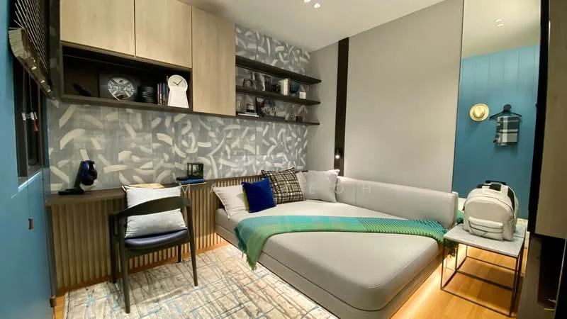 Bedroom features: grey upholstered daybed, blue and green throw blanket, wooden flooring, decorative area rug, wall-mounted shelves, blue accent wall, grey painted walls, desk with chair, table lamp, decorative wall art, mirror, backpack on chair; style: modern.