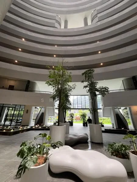 Room features: curved ceiling with horizontal stripes, large glass windows, indoor plants in white planters, white sculptural seating, grey tiled flooring, multiple levels visible, open atrium space, modern lighting fixtures; style: modern; view: garden.