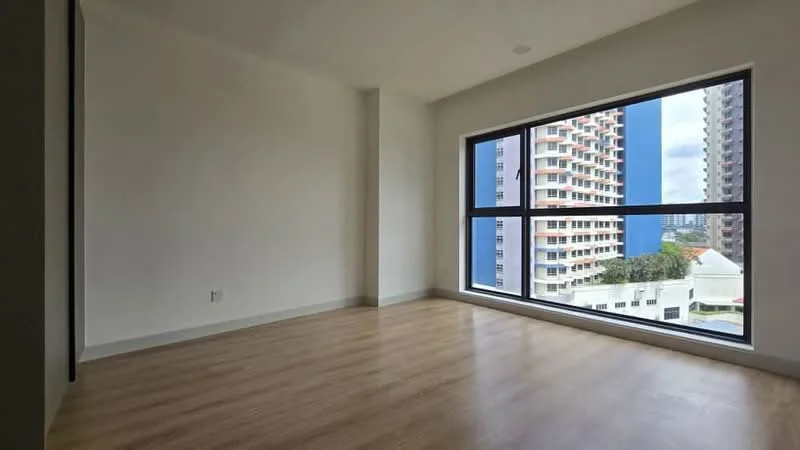 Room features: large floor-to-ceiling windows, wooden flooring, neutral painted walls, minimalist design, city view, no visible furniture, bright natural light, open layout; style: modern; view: city.