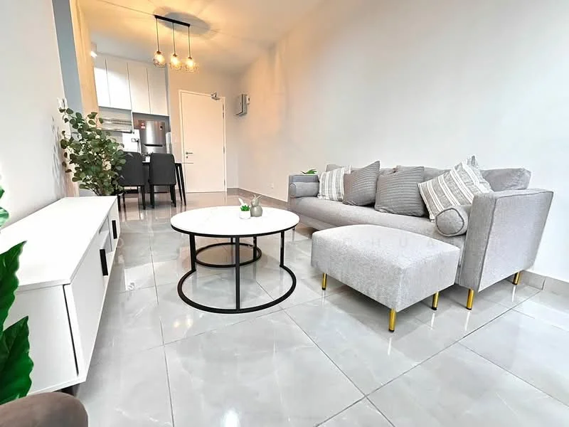 Living features: grey L-shape sectional sofa, decorative cushions, round coffee table with black metal base, white TV console, marble tile flooring, recessed ceiling lights, wall-mounted air conditioning unit, indoor plants, neutral painted walls, open layout to kitchen area; style: modern.