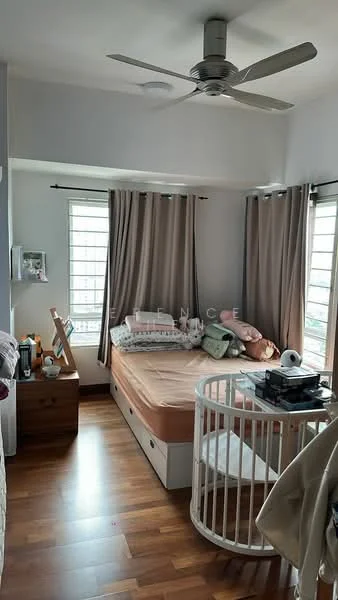 Bedroom features: queen-size bed with beige bedding, wooden flooring, 5-blade ceiling fan with light, two windows with white grills, beige curtains, wooden bedside table, crib, decorative wall art, wall-mounted shelf, dressing table with mirror; style: modern.