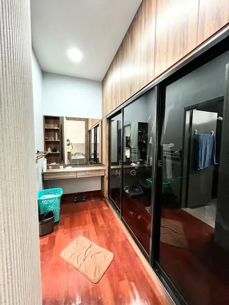 Laundry features: wood paneling on walls, dark glass sliding doors, wooden flooring, built-in shelving, large mirror, recessed ceiling lights, laundry basket, area rug, storage cabinets; style: modern.