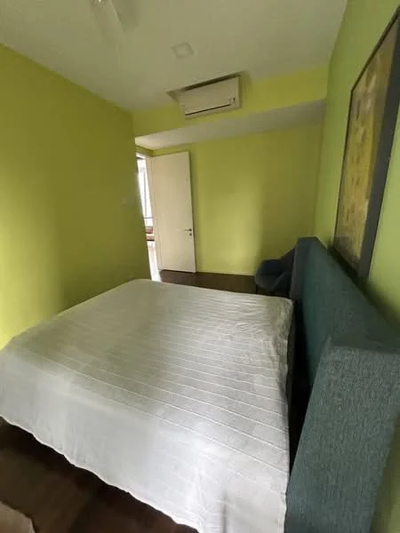 Bedroom features: green painted walls, wood flooring, queen-size bed, upholstered headboard, 1 wall-mounted split AC, ceiling fan, decorative artwork on wall, door leading to hallway.
