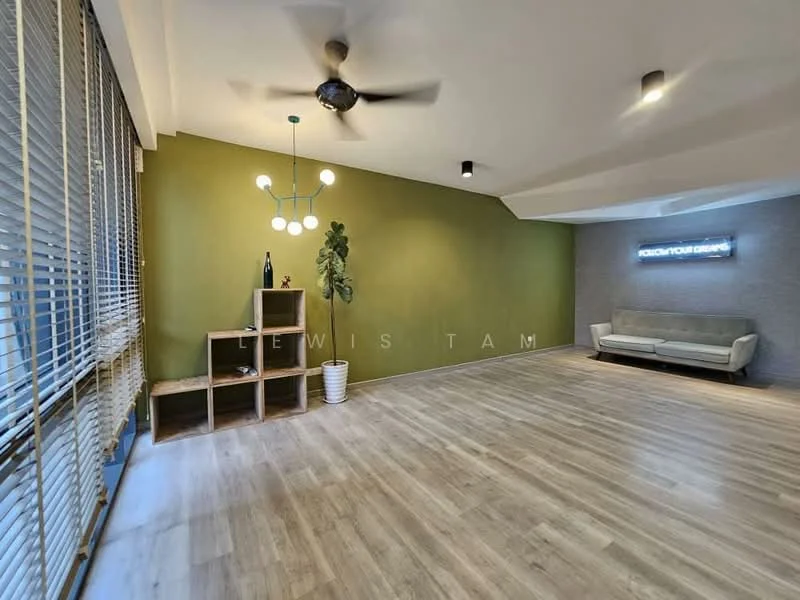 Living features: light wood flooring, green accent wall, grey textured wall, 5-blade ceiling fan, modern pendant light, large windows with blinds, built-in shelving unit, decorative plant, sofa in light grey, LED wall signage; style: modern.