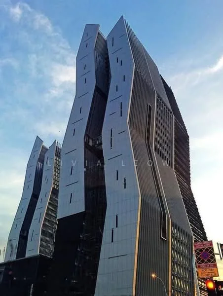 Exterior type: high-rise condominium; features: glass curtain wall, white painted facade, angular architectural design, projecting balconies, feature lighting at night, approximately 20-storey high-rise; style: modern.
