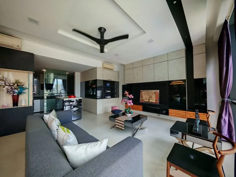 Living features: 5-blade ceiling fan with light, grey fabric sofa, decorative cushions, coffee table, wall-mounted TV, entertainment unit with wooden cabinetry, black accent wall, recessed ceiling with downlights, large windows with sheer curtains, decorative plants, open layout to kitchen, polished concrete flooring; style: modern; view: city. Kitchen features: black cabinetry, stainless-steel appliances, open-plan layout, kitchen island, recessed lighting; style: modern.