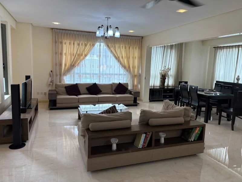 Living features: cream painted walls, marble tile flooring, 5-blade ceiling fan with light, floor-to-ceiling windows, sheer curtains, L-shape sectional sofa in beige, coffee table with glass top, decorative wall shelving, TV console, wall-mounted TV, area rug with geometric pattern, dining table with black chairs, sideboard cabinet, decorative vase with flowers; style: modern; view: city.