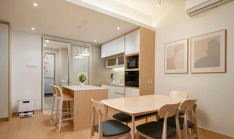 Kitchen features: white cabinetry, wooden countertop, stainless-steel sink, chrome pull-down faucet, built-in microwave, freestanding range oven, refrigerator, pendant lighting, open shelving, dining table with four chairs, wooden flooring, wall-mounted split AC; style: modern. Room features: light-colored walls, framed artwork.