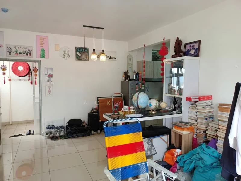 Room features: white painted walls, glossy tile flooring, recessed downlights, hanging pendant lights, kitchen counter with cabinets, refrigerator, bookshelves filled with books, decorative globe, various decorative items, cluttered space with personal items, folding chair, colorful fabric on the floor; style: modern.