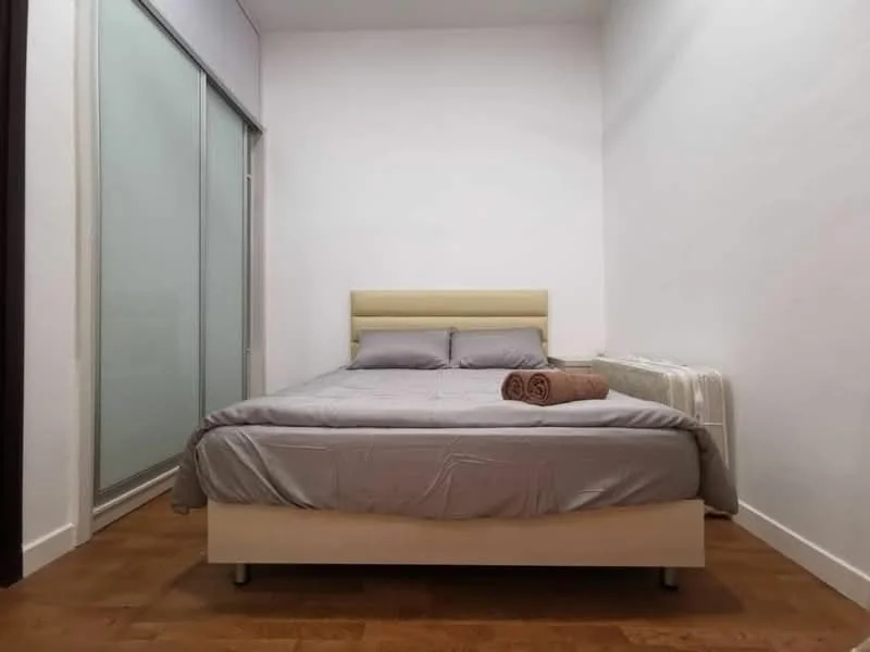 Bedroom features: queen-size bed, upholstered headboard, grey bedding, two rolled towels, wooden flooring, white painted walls, sliding glass wardrobe, nightstand, window with sheer curtains; style: modern.