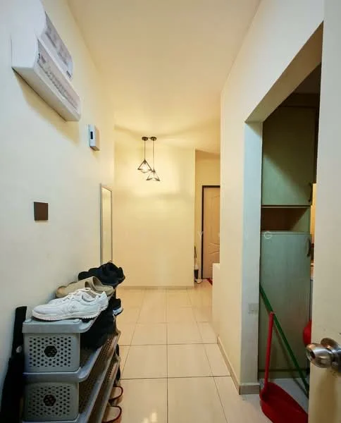 Hallway features: white painted walls, tile flooring, 1 wall-mounted split AC, mirror on wall, hanging pendant light, shoe rack with storage boxes, doorway leading to another room, green cleaning equipment, light-colored cabinetry; style: modern.
