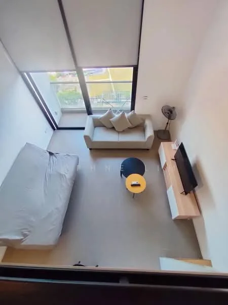Living features: grey fabric sofa, round black coffee table, TV console with storage, wall-mounted TV, floor-to-ceiling windows, light-colored flooring, ceiling fan, decorative cushions; style: modern; view: city.