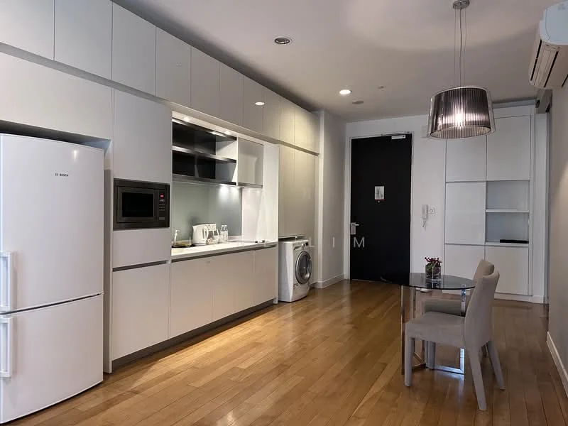 Kitchen features: white cabinetry with flat-panel design, stainless-steel fridge, built-in microwave, ceramic cooktop, single-bowl stainless-steel sink, chrome pull-down faucet, washing machine, wooden flooring, recessed downlights, dining table for two, upholstered dining chairs, wall-mounted air conditioning unit; style: modern.