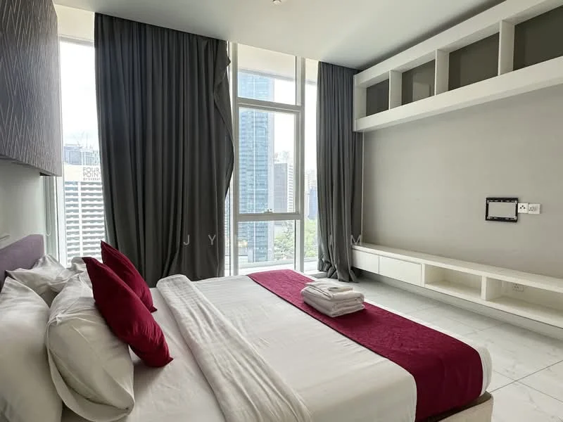 Bedroom features: king-size bed with white linens, red accent throw blanket, two red decorative pillows, floor-to-ceiling windows, grey curtains, built-in wall shelving, white cabinetry, marble flooring, wall-mounted TV, remote control panel, city view; style: modern; view: city.