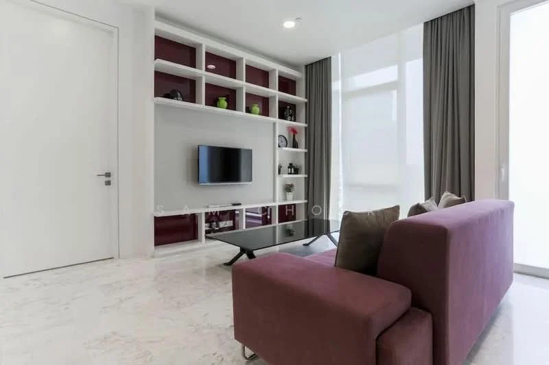 Living features: marble flooring, white painted walls, built-in shelving unit with red backing, wall-mounted TV, black coffee table, sofa in burgundy, floor-to-ceiling windows, sheer curtains, decorative items on shelves, recessed lighting; style: modern.