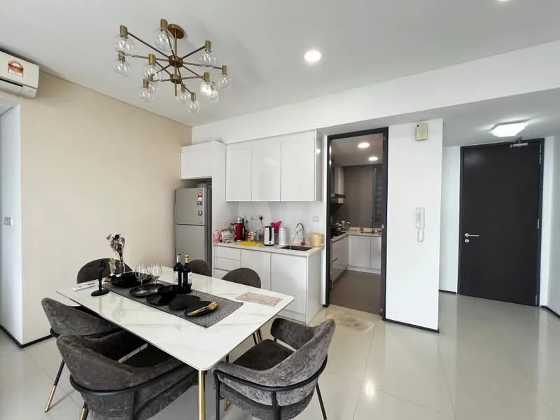 Dining features: marble dining table, 4 upholstered dining chairs in grey, chandelier with multiple bulbs, white painted walls, sliding glass door, floor-to-ceiling windows, grey tiled flooring, open layout to kitchen, decorative vase with flowers; style: modern. Kitchen features: white cabinetry, stainless-steel fridge, built-in microwave, freestanding range oven, kitchen countertop, kitchen island, grey tiled flooring; style: modern.