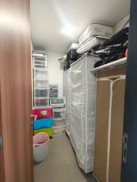 Room features: built-in storage cabinets, plastic storage bins, hanging garment bags, open shelving, tile flooring, white walls, door with wood finish, basket for laundry; style: minimalist.