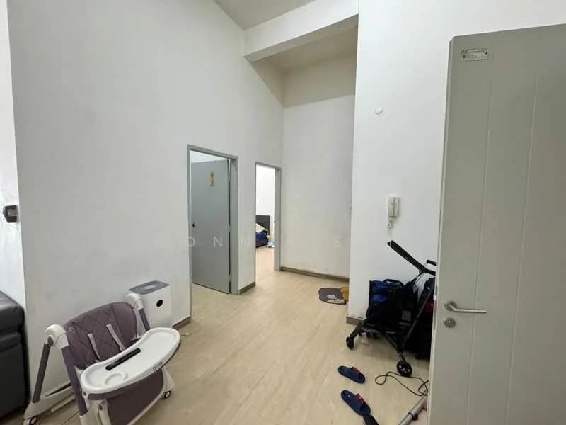 Room features: white painted walls, light wood flooring, high ceiling, doorway leading to another room, doorway leading to bathroom, wall-mounted intercom, small white cabinet, exercise equipment, baby high chair, slippers on the floor; style: modern.