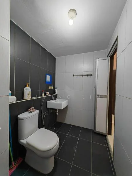 Bathroom features: white toilet, wall-mounted sink, chrome faucet, grey tiled walls, black tiled flooring, mirror above sink, shower enclosure, towel rack, light fixture on ceiling; style: modern.