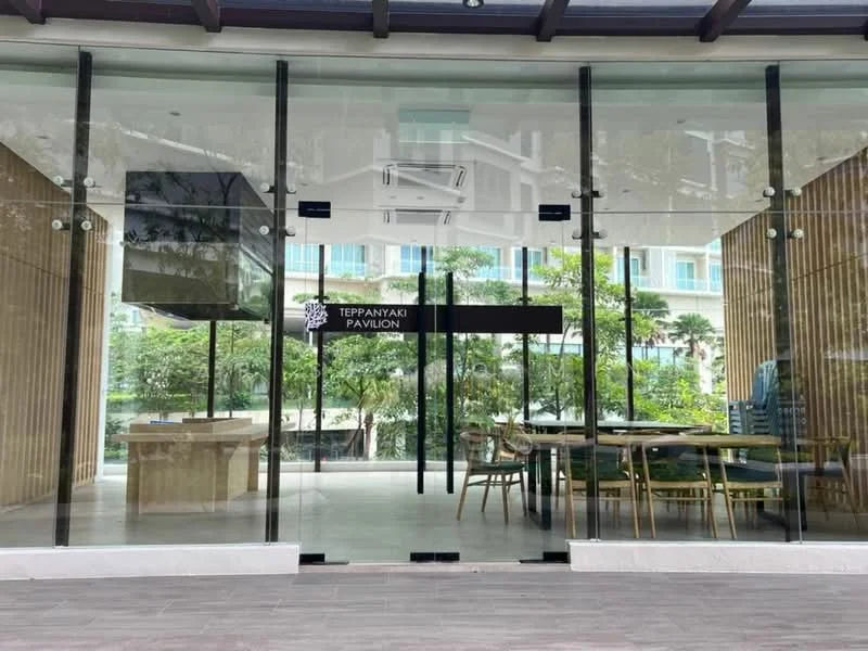 Exterior type: restaurant; features: glass facade, wood paneling, outdoor seating area, landscaped greenery, double glass doors, signage for Teppanyaki Pavilion, modern architectural design; style: contemporary.