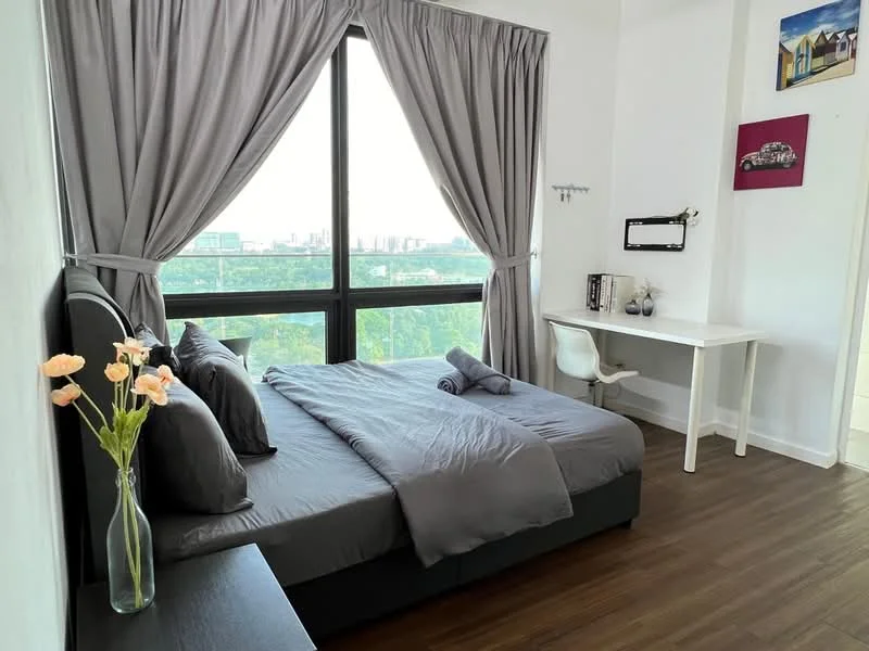 Bedroom features: king-size bed with grey bedding, upholstered headboard, floor-to-ceiling windows, grey curtains, wooden flooring, study desk with chair, decorative wall art, vase with flowers, nightstand, mirror, sheets and towels rolled on the bed; style: modern; view: city.