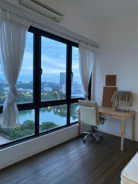 Study features: large floor-to-ceiling windows, white sheer curtains, wooden desk, ergonomic office chair, wooden flooring, view of water and greenery, minimalist decor, wall-mounted corkboard; style: modern; view: garden.