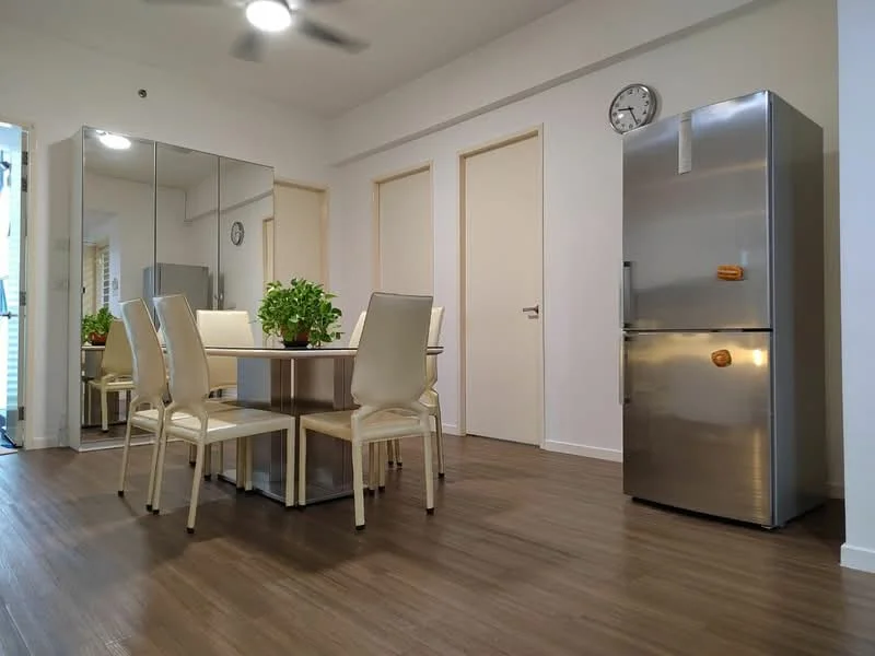 Dining features: dining table with 6 chairs, stainless-steel fridge, wooden flooring, white painted walls, mirror wall, ceiling fan, clock on wall, potted plants; style: modern.