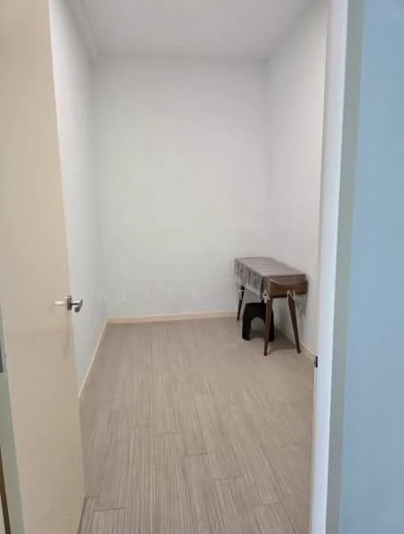 Room features: light-colored painted walls, wood-look tile flooring, single door, small wooden desk, black chair; style: minimalist.
