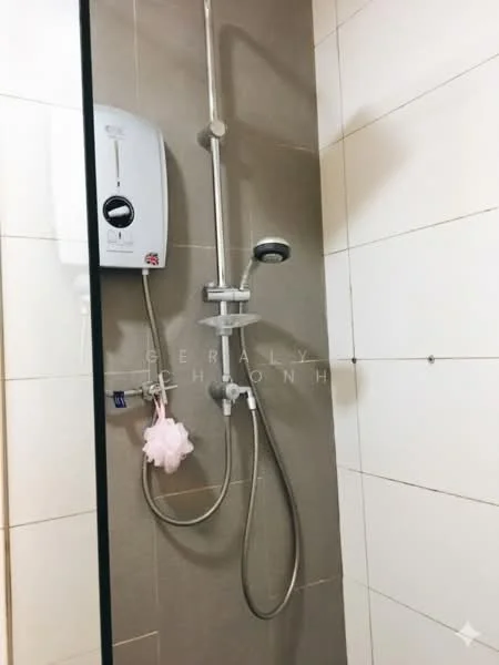 Bathroom features: shower with glass enclosure, chrome handheld showerhead, chrome wall-mounted faucet, water heater, tile cladding on walls, white ceramic tiles, grey accent wall, shower curtain rod, soap holder; style: modern.