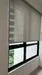 Room features: roller blinds, black window frame, floor-to-ceiling window, natural light, greenery view; view: garden.