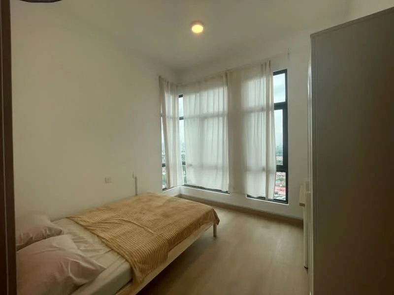 Bedroom features: queen-size bed, white bedding, light wood bed frame, floor-to-ceiling windows, sheer curtains, wooden flooring, white painted walls, ceiling light fixture, corner window seat, built-in wardrobe; style: modern; view: city.