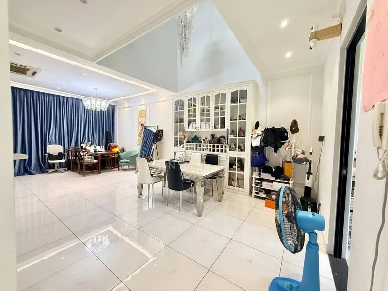 Living features: white painted walls, high ceiling with chandelier, large floor-to-ceiling windows, grey curtains, polished ceramic tile flooring, dining table with chairs, glass display cabinet, green armchair, fan, decorative items on shelves, wall-mounted intercom, open layout; style: modern.