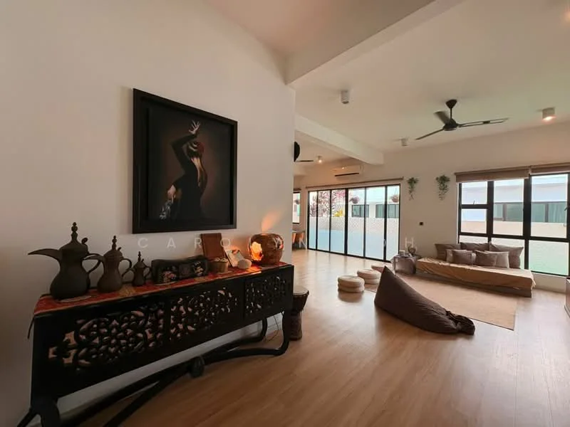 Living features: wooden flooring, white painted walls, exposed beams, 5-blade ceiling fan, large windows, sliding glass doors, decorative wall art, low seating cushions, decorative console table, ceramic decorative items, ambient lighting; style: modern; view: garden.