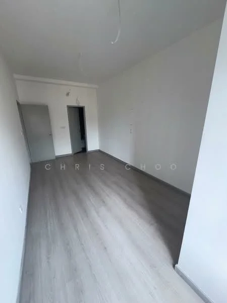 Room features: light grey laminate flooring, white painted walls, crown moulding, single ceiling light fixture, doorway leading to another room, no visible windows, empty space; style: modern.