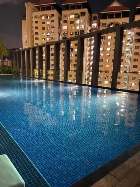 Exterior type: high-rise condominium; features: infinity pool, pool deck with loungers, glass railing, night lighting, surrounding greenery, city skyline view; style: modern.