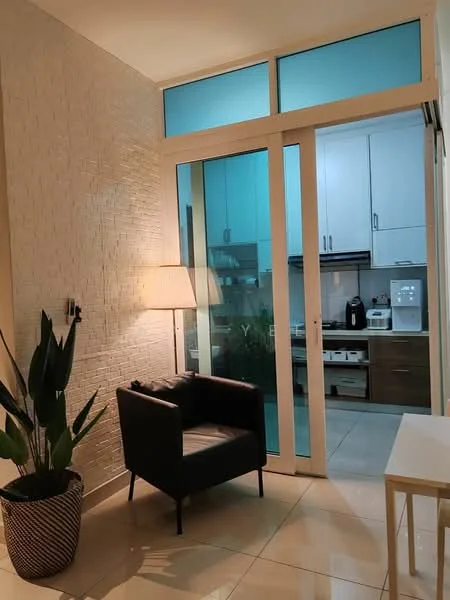 Room features: textured white accent wall, large glass sliding door, tile flooring, indoor plant in decorative pot, black armchair, lamp with shade, white side table, kitchen visible through glass door, white cabinetry in kitchen, stainless-steel appliances in kitchen; style: modern.