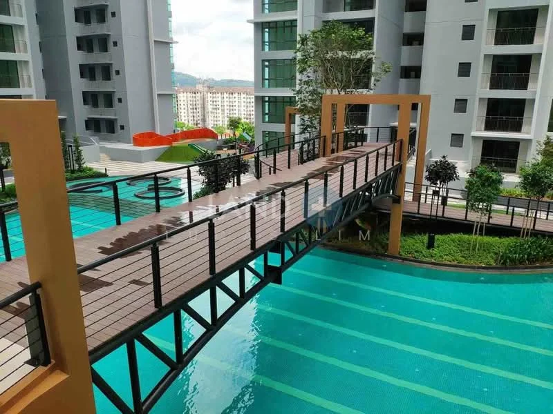 Exterior type: high-rise condominium; features: wooden bridge over water, swimming pool with clear blue water, landscaped garden with greenery, children's play area in background, modern architectural design, multiple levels of the building visible, balconies on upper floors, surrounding urban landscape; style: modern.