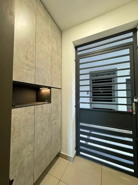 Room features: grey textured cabinetry, built-in storage with lighting, black metal security door with horizontal slats, cream tiled flooring, white painted walls, window with black frame; style: modern.