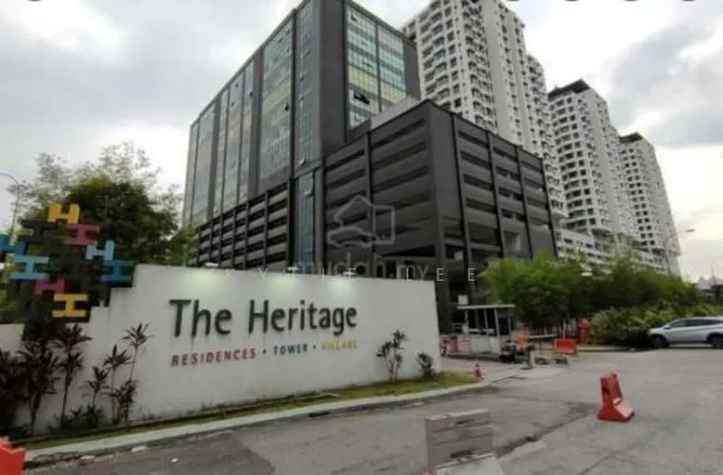Exterior type: high-rise condominium; features: glass curtain wall, black painted facade, white painted facade, multiple storeys, landscaped entrance, signage with name 'The Heritage', surrounded by greenery, driveway with interlocking pavers; style: modern.