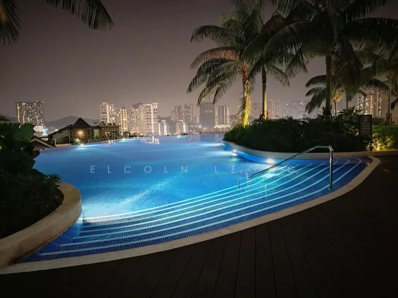 Exterior type: swimming pool deck; features: infinity edge pool, poolside loungers, palm trees, landscaped garden, night lighting, city skyline in background, wooden decking, water feature; style: modern.