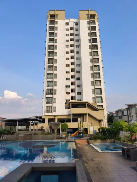 Exterior type: high-rise condominium; features: white painted facade, balconies on upper floors, swimming pool, children's playground, manicured landscaping, pool deck with loungers, covered parking area, multi-storey structure, surrounded by greenery; style: modern.
