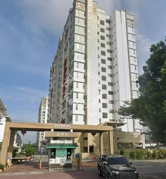 Exterior type: mid-rise condominium; features: white painted facade, red accent panels, glass windows, entrance gate with signage, paved driveway, surrounded by greenery, parking area, multiple storeys, balconies on upper floors; style: modern.