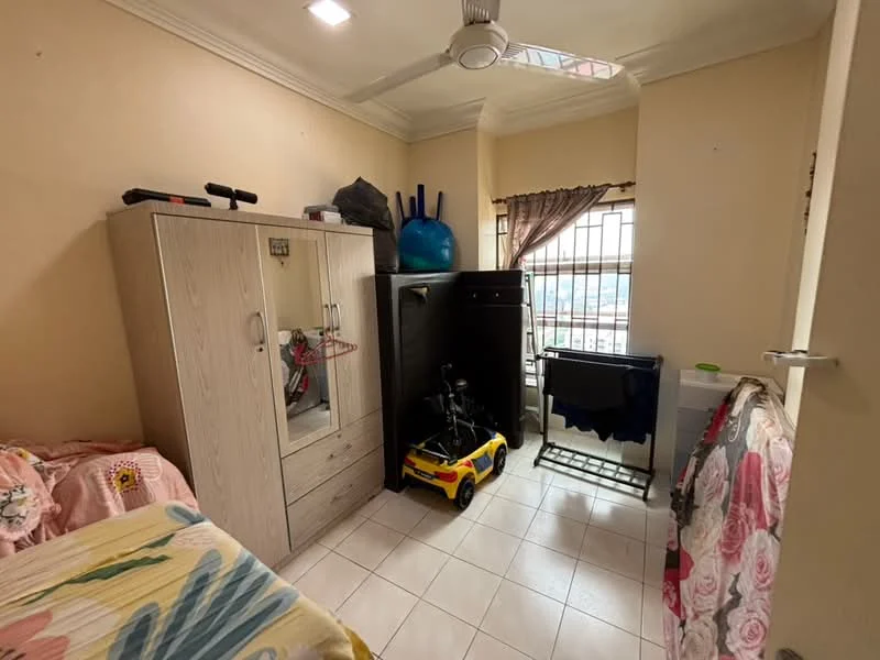 Bedroom features: single bed with floral bedding, built-in wardrobe with mirror, black dresser, window with security bars, ceiling fan, tile flooring, decorative curtains, toy car, exercise equipment, laundry drying rack; view: city.