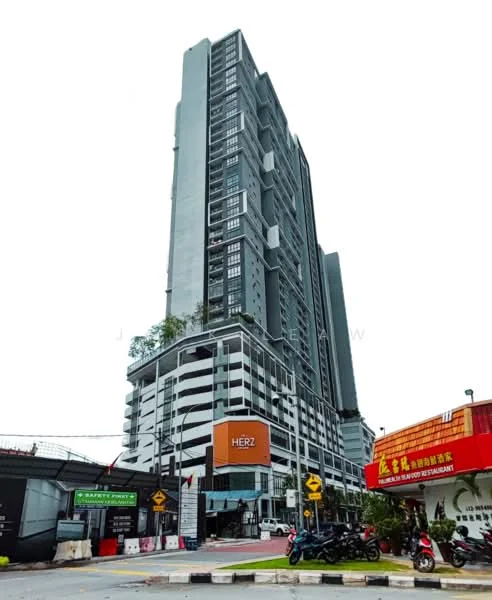 Exterior type: high-rise condominium; features: grey concrete facade, glass curtain wall, recessed balconies, projecting balconies, signage on building, surrounded by road, multiple storeys, urban context; style: modern.