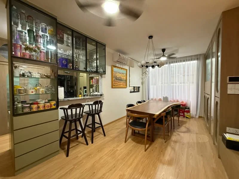 Dining features: wooden dining table, 8 dining chairs, glass-front cabinetry, bar counter with stools, ceiling fan, large window with sheer curtains, wooden flooring, decorative artwork on wall; style: modern.