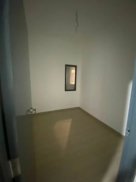 Room features: white painted walls, laminate flooring, small window, ceiling light fixture.