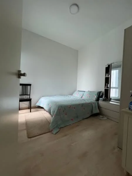 Bedroom features: queen-size bed with floral bedding, wooden chair, light wood flooring, white painted walls, built-in wardrobe, window with natural light, area rug, ceiling light fixture; style: modern.